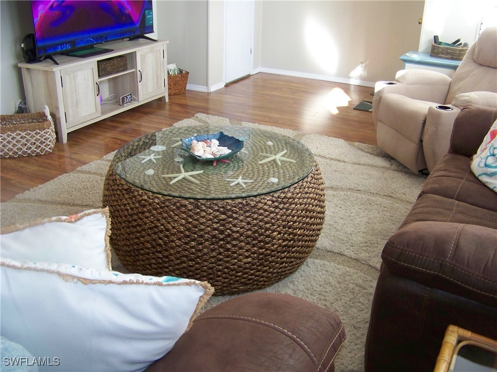 15550 Burnt Store Road, Unit 63 Punta Gorda, FL 33955 - Photo 11 of 47 a living room with furniture