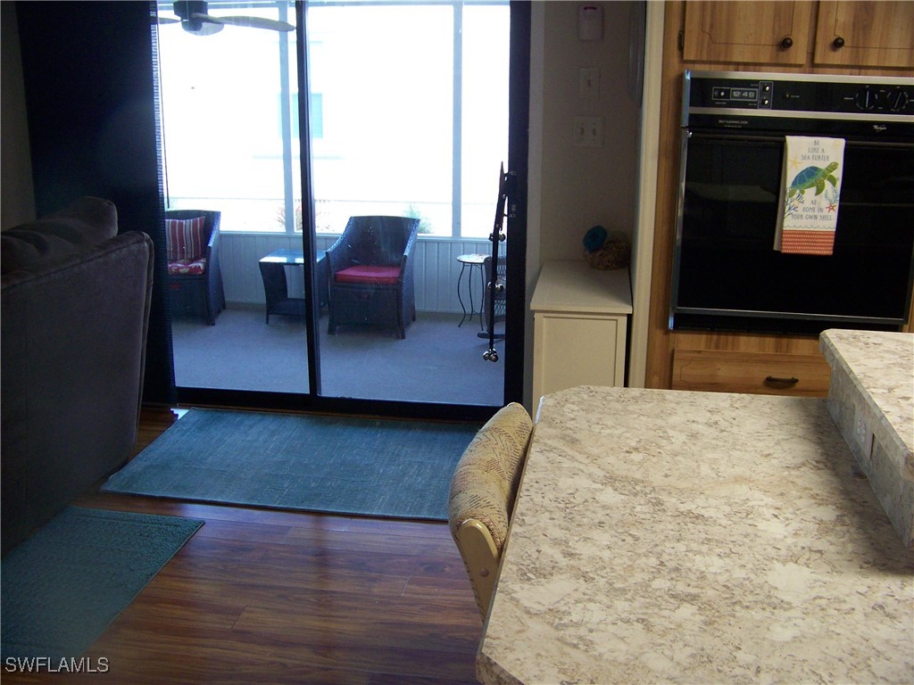 15550 Burnt Store Road, Unit 63 Punta Gorda, FL 33955 - Photo 19 of 47 a living room with furniture and a flat screen tv