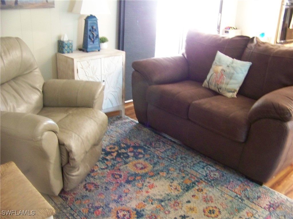15550 Burnt Store Road, Unit 63 Punta Gorda, FL 33955 - Photo 22 of 47 a living room with a couch and a rug