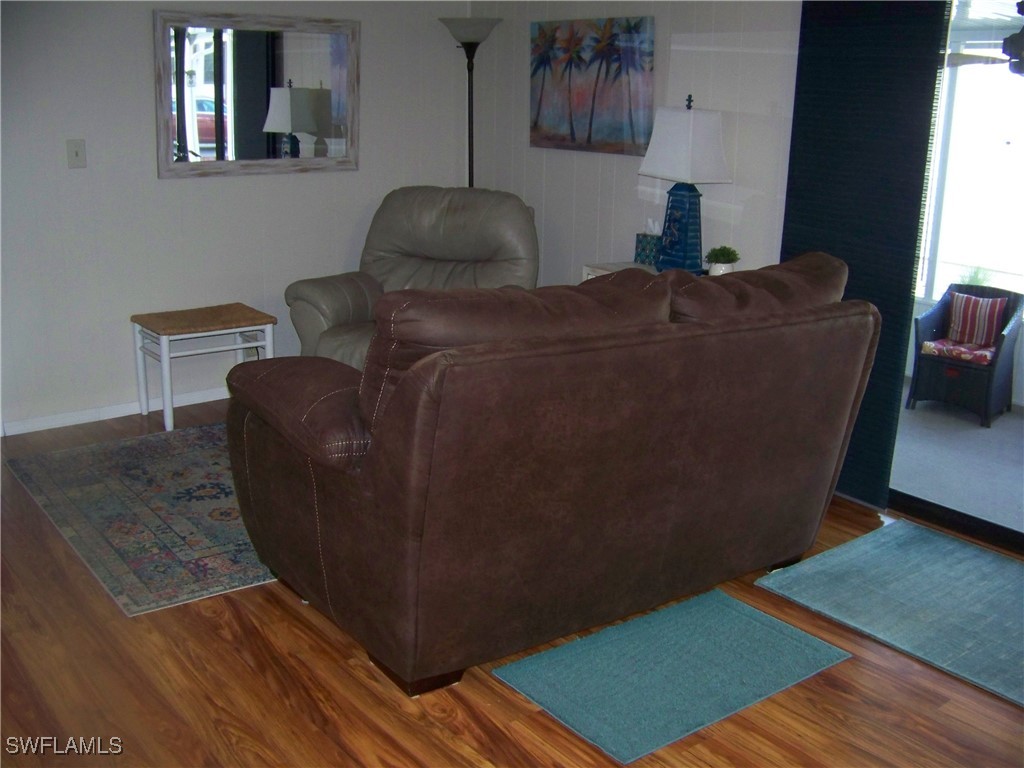 15550 Burnt Store Road, Unit 63 Punta Gorda, FL 33955 - Photo 24 of 47 a living room with furniture and a window