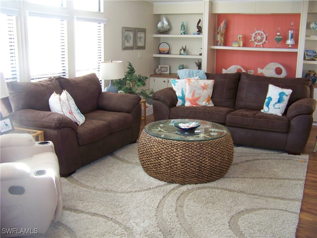 15550 Burnt Store Road, Unit 63 Punta Gorda, FL 33955 - Photo 7 of 47 a living room with furniture and a window