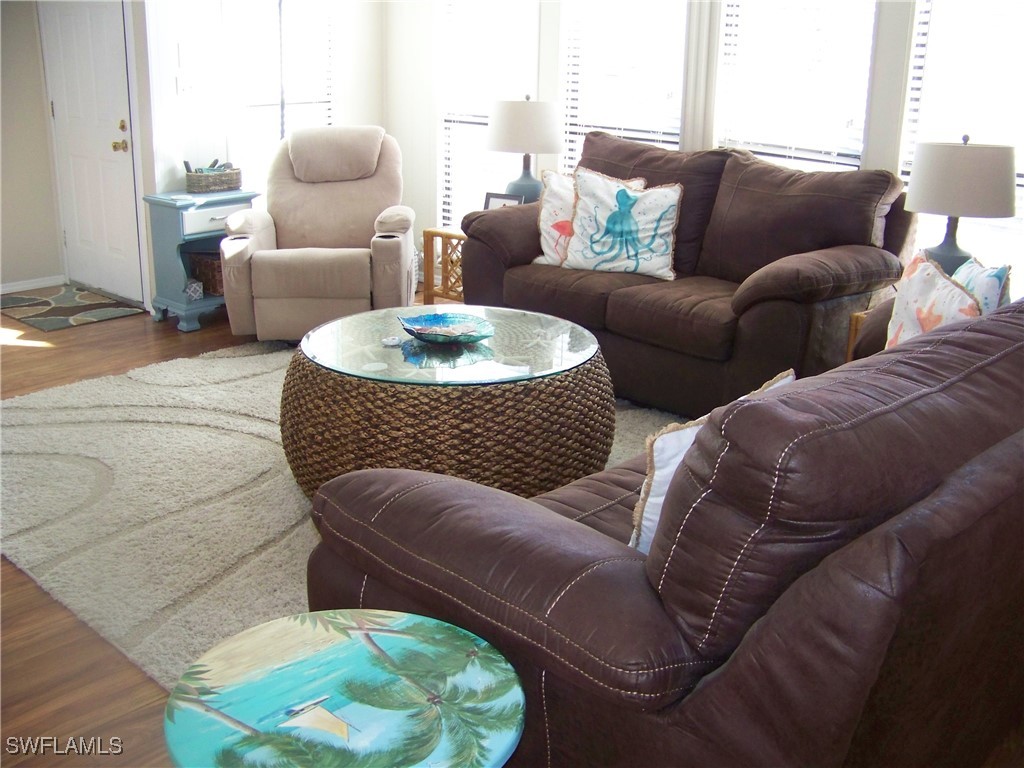 15550 Burnt Store Road, Unit 63 Punta Gorda, FL 33955 - Photo 9 of 47 a living room with furniture and a couch