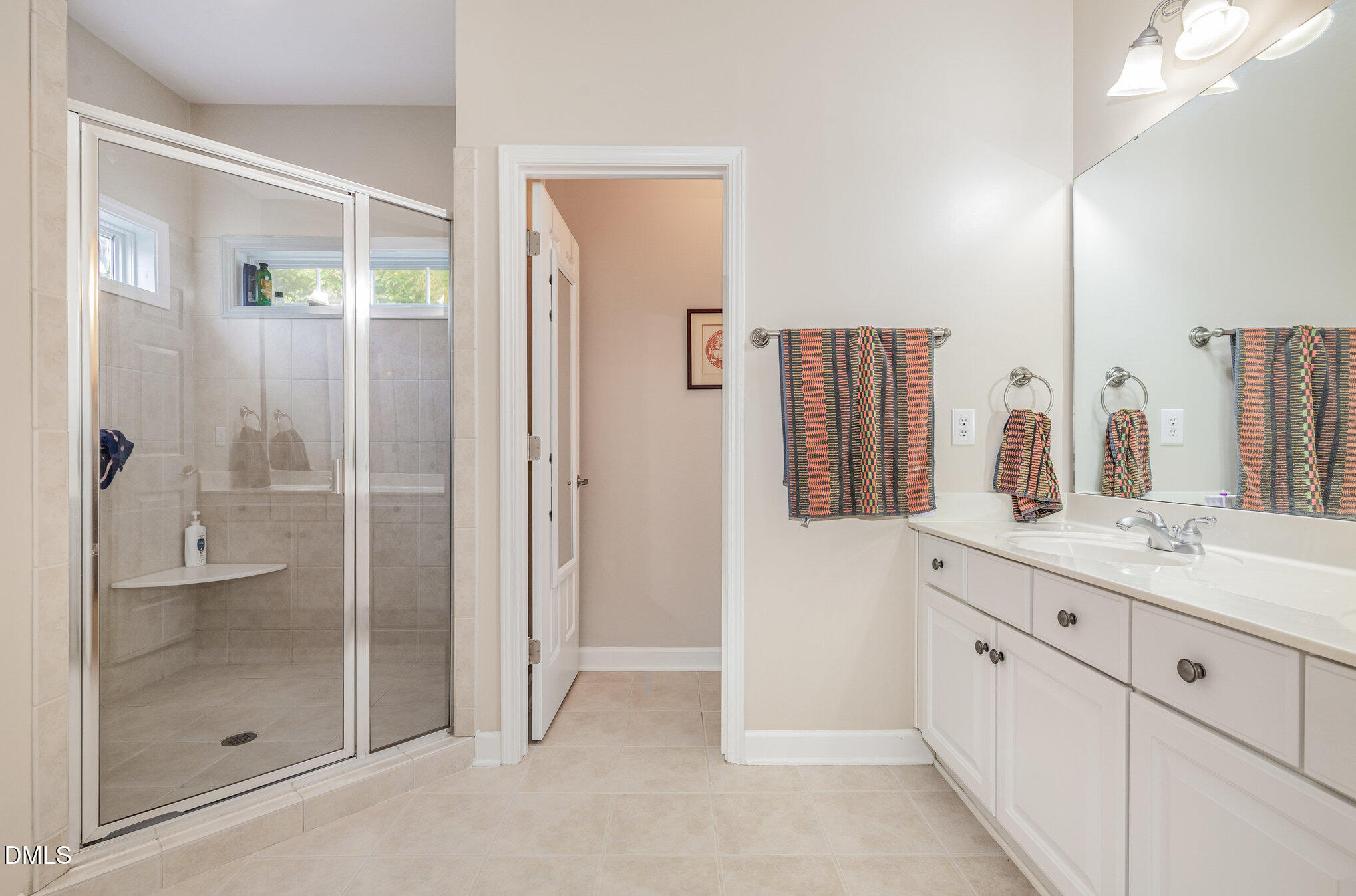 2541 Forest Shadows Lane Raleigh, NC 27614 - Photo 17 of 23 a bathroom with a granite countertop sink mirror and shower