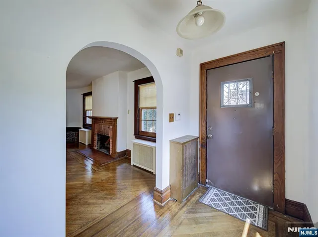 a view of livingroom with hardwood floor and dining room