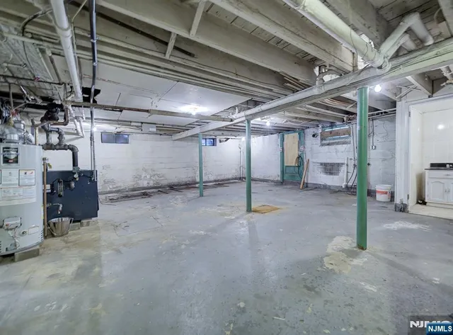 a view of empty room with wooden ceiling