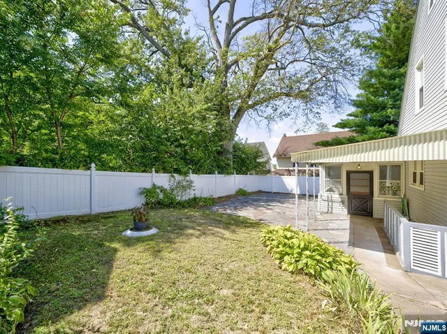 a view of a backyard with a sitting area