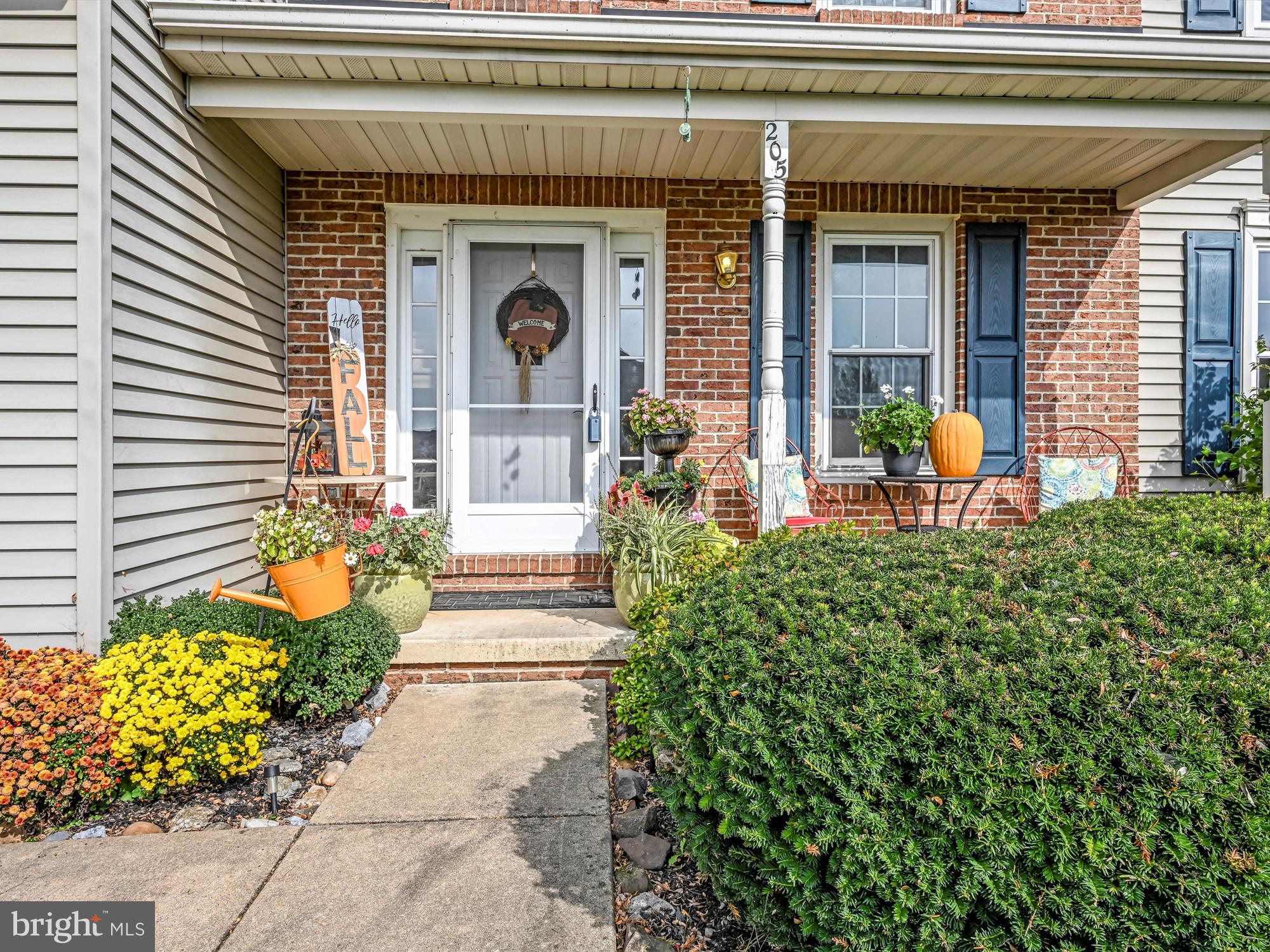 205 Village Spring Lane Reinholds, PA 17569 - Photo 2 of 29 a front view of a house with outdoor seating