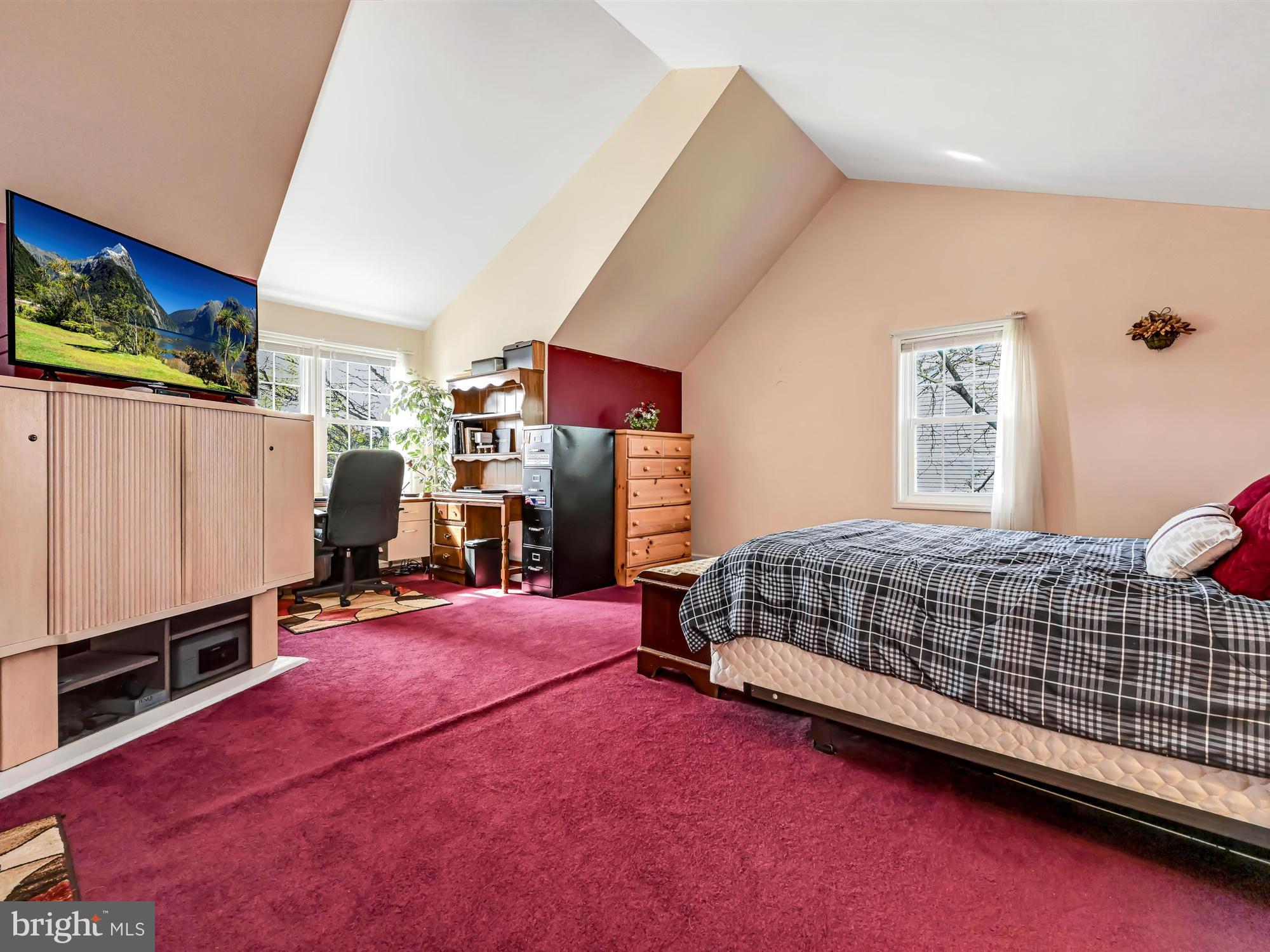 205 Village Spring Lane Reinholds, PA 17569 - Photo 19 of 29 a bedroom with a bed and a flat tv screen