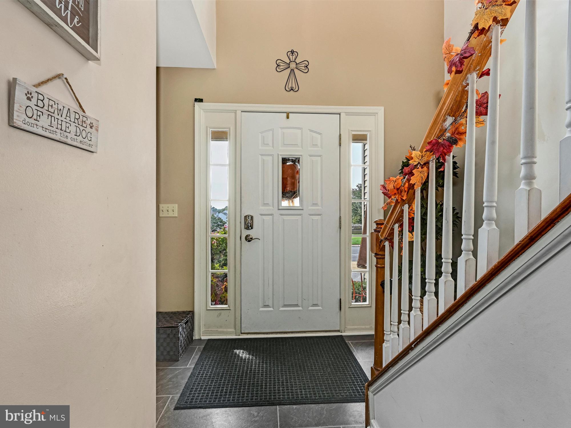 205 Village Spring Lane Reinholds, PA 17569 - Photo 3 of 29 a view of an entryway with wooden floor and door