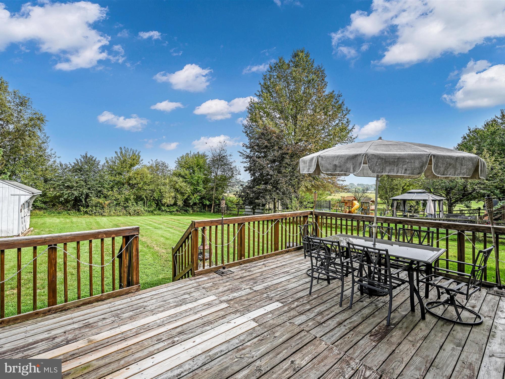 205 Village Spring Lane Reinholds, PA 17569 - Photo 26 of 29 a view of a wooden deck with furniture