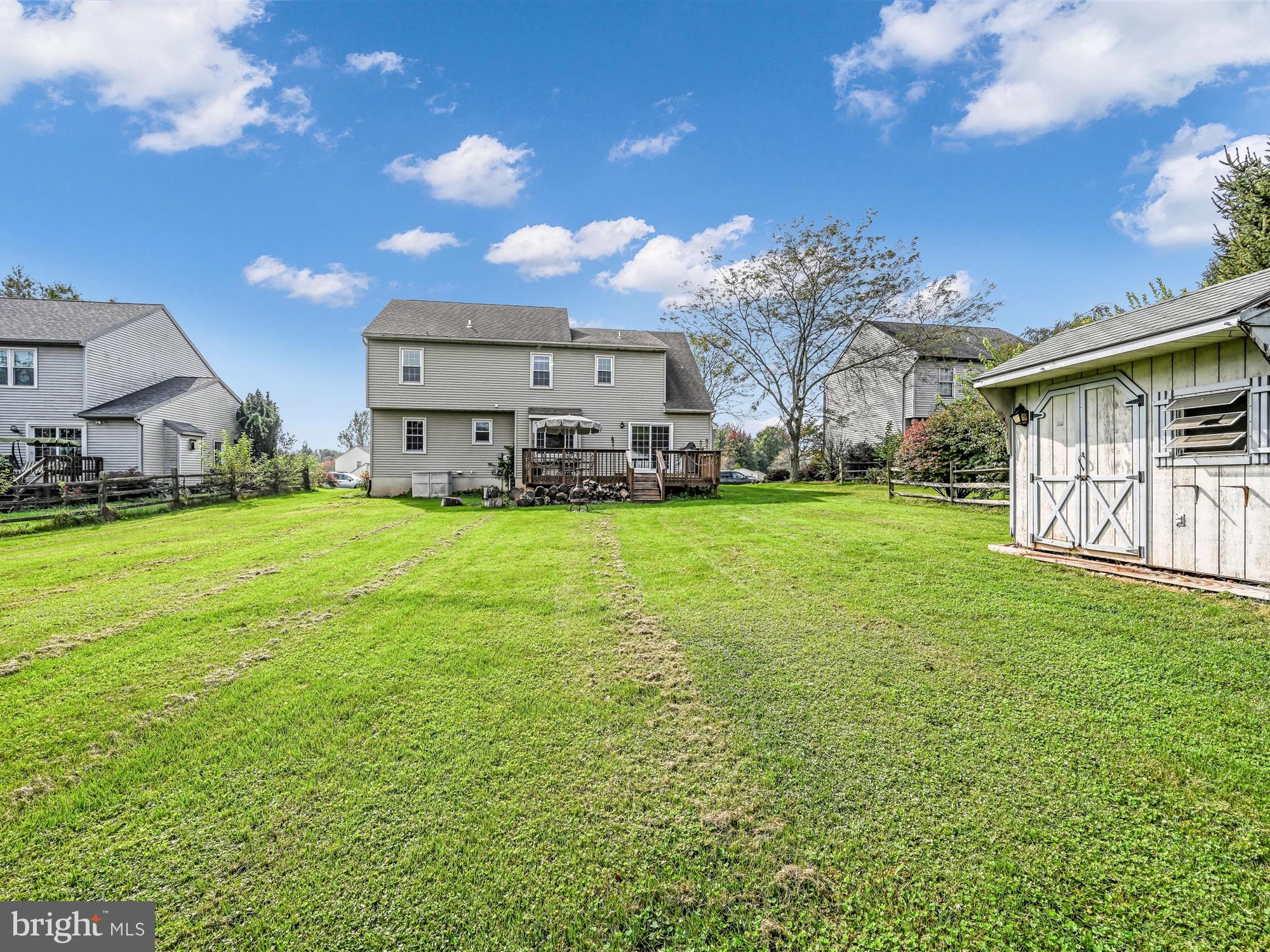 205 Village Spring Lane Reinholds, PA 17569 - Photo 29 of 29 a view of a house with a big yard and large trees
