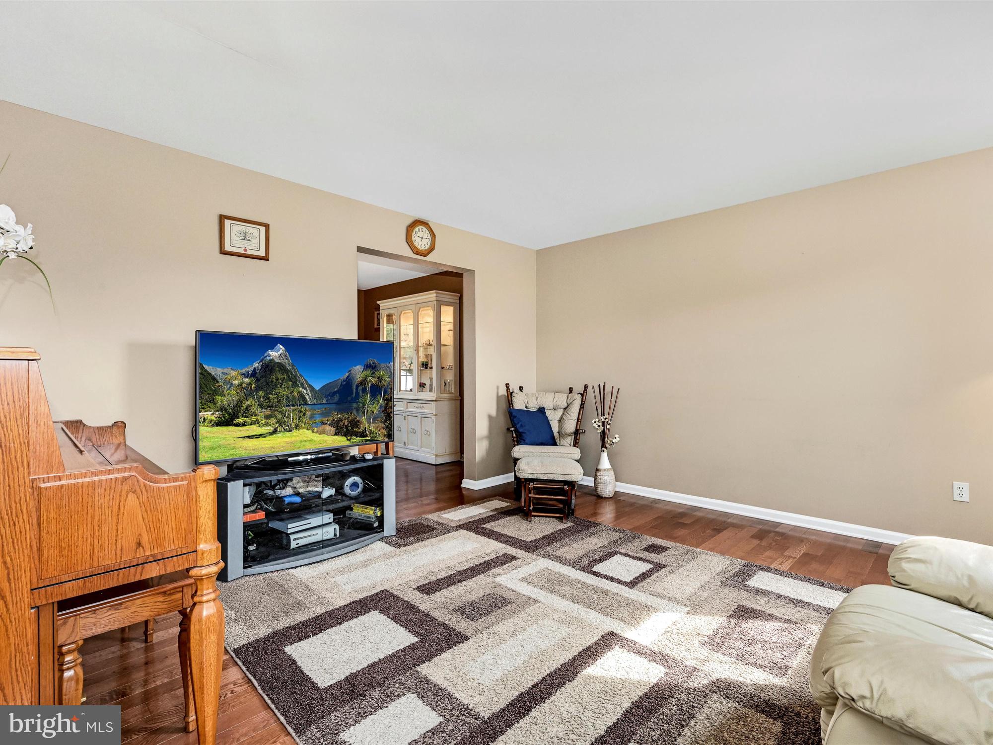 205 Village Spring Lane Reinholds, PA 17569 - Photo 5 of 29 a bedroom with a bed and flat screen tv