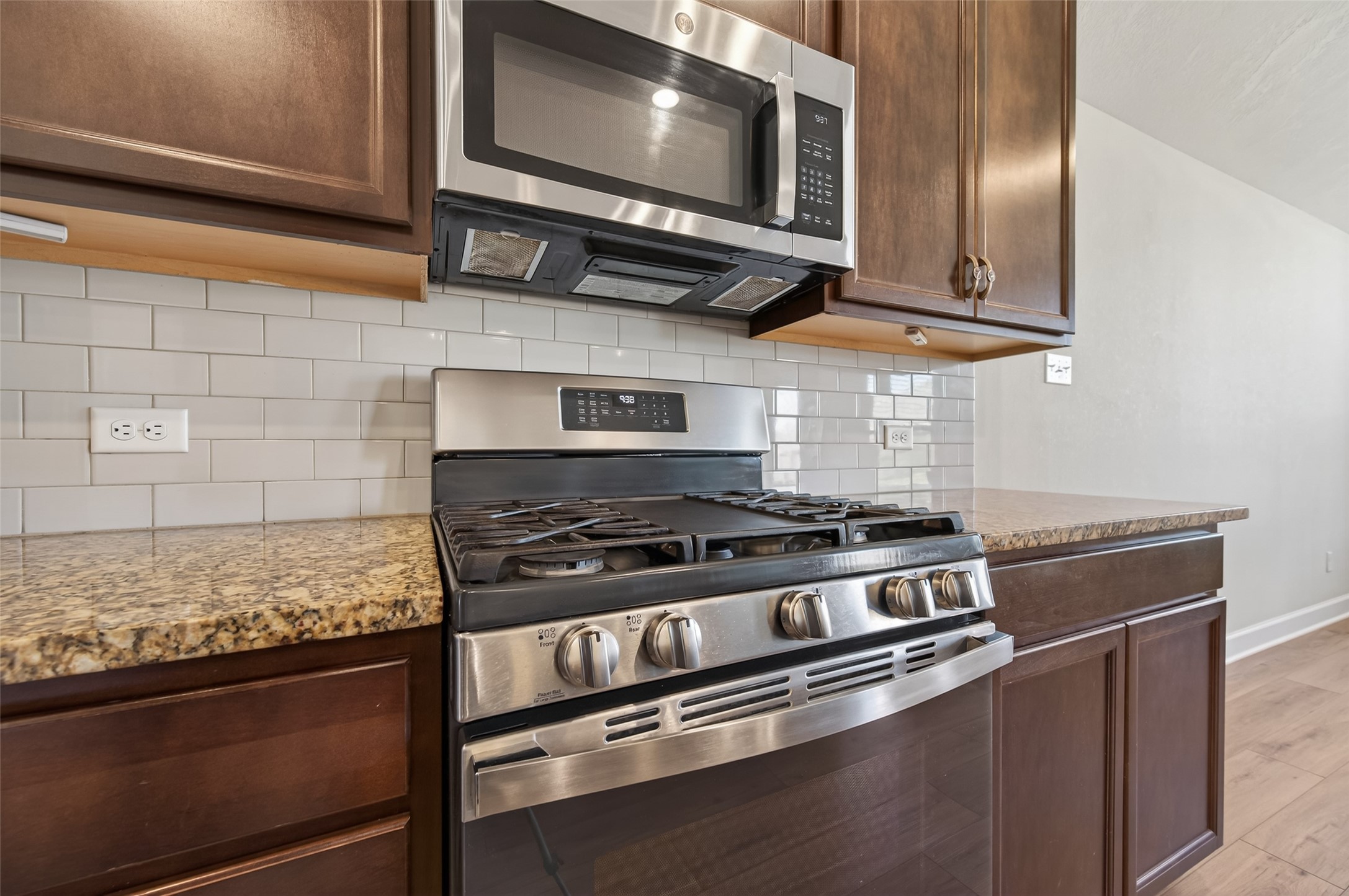 917 Farm Path Brenham, TX 77833 - Photo 16 of 43 a kitchen with stainless steel appliances granite countertop a stove and a microwave