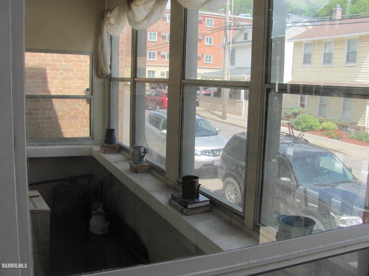 328 Franklin Street Galena, IL 61036 - Photo 10 of 13 a room with a large window and mirror