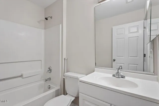 a bathroom with a sink a toilet and a bathtub