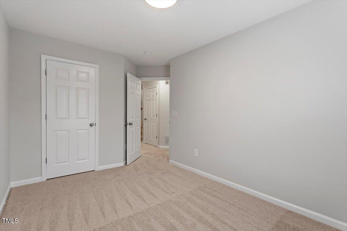 8600 Neuse Landing Lane, Unit 106 Raleigh, NC 27616 - Photo 16 of 22 a view of an empty room