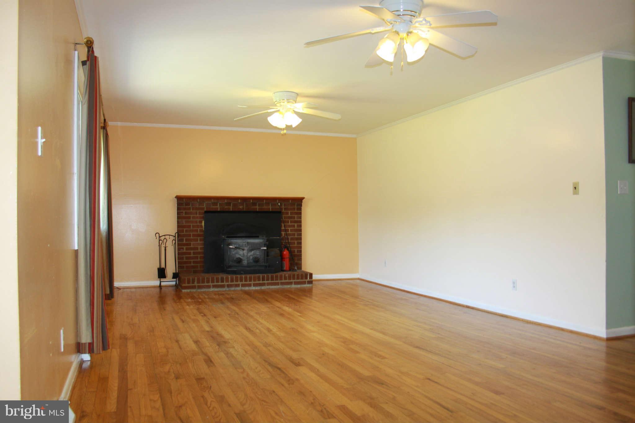 6264 Shady Side Road Shady Side, MD 20764 - Photo 5 of 29 Living Room with Wood burning Fireplace