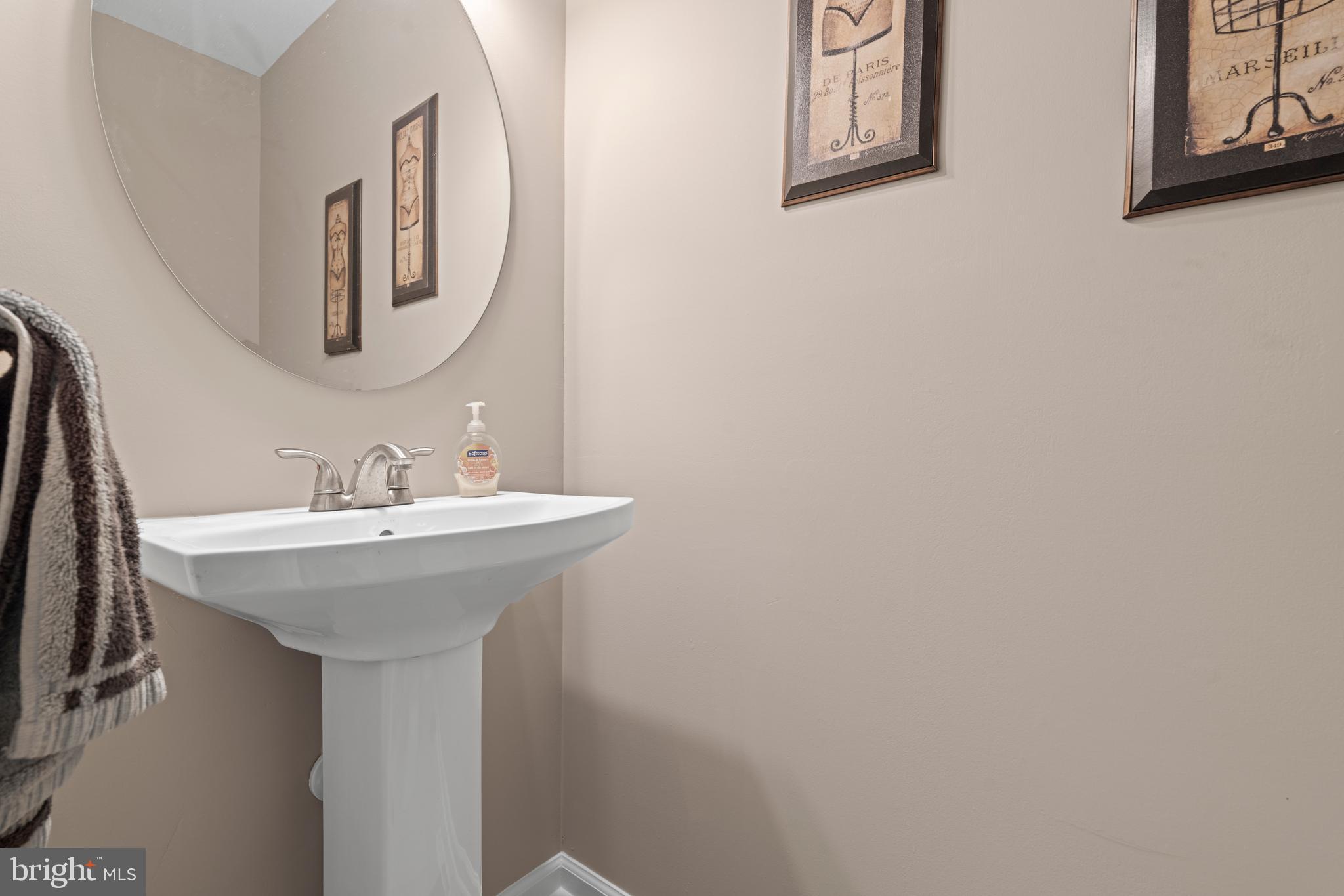 20 Farm Ridge Court Baldwin, MD 21013 - Photo 15 of 47 a bathroom with a sink and mirror