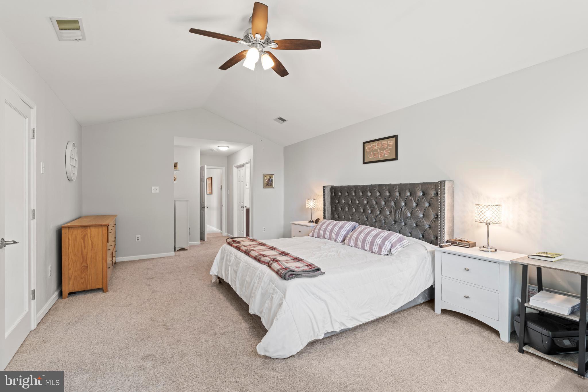 20 Farm Ridge Court Baldwin, MD 21013 - Photo 19 of 47 a spacious bedroom with a bed and a chandelier