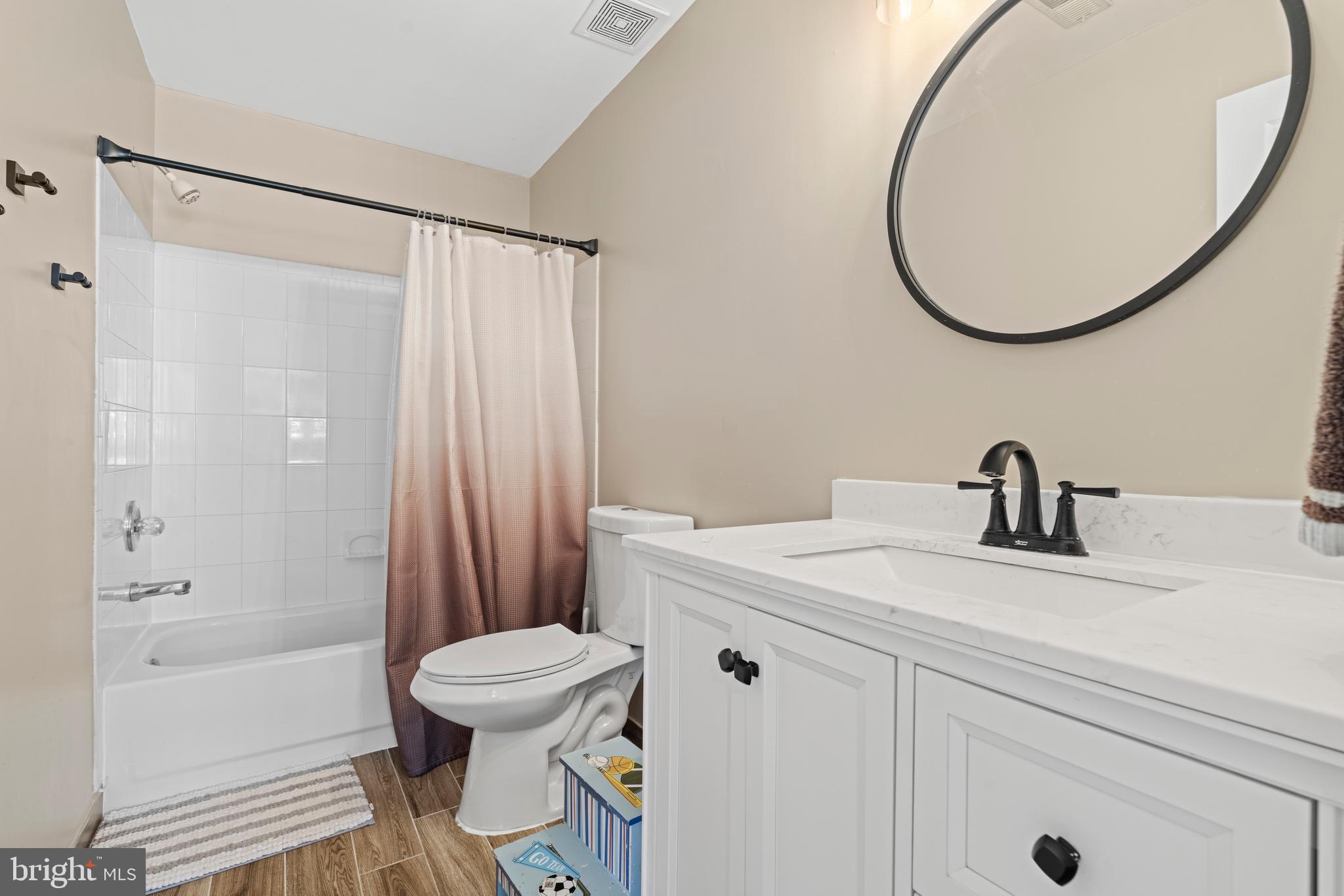 20 Farm Ridge Court Baldwin, MD 21013 - Photo 29 of 47 a bathroom with a sink a toilet and a mirror