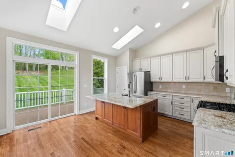 a kitchen with a stove a sink and a refrigerator
