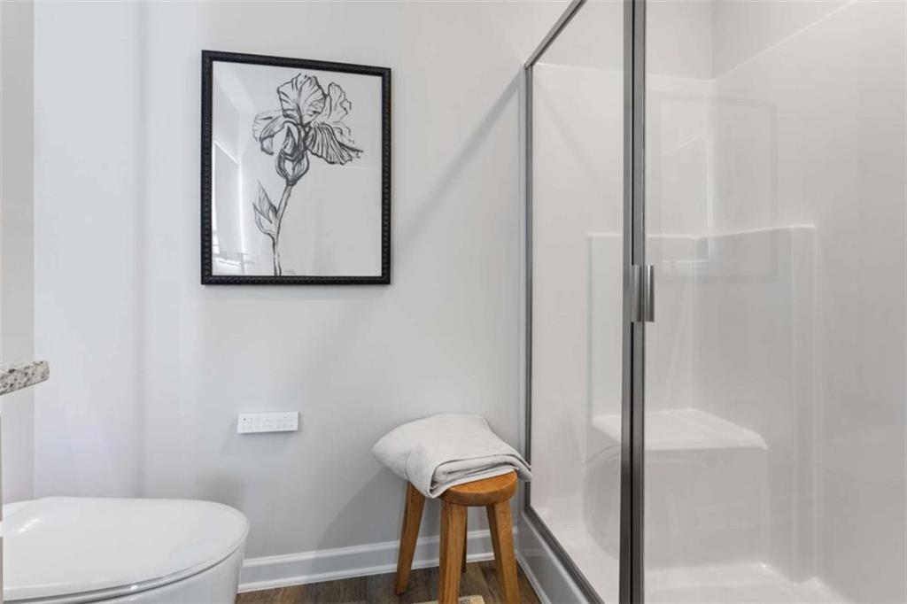 116 Meadowview Drive, Unit 8 Temple, GA 30179 - Photo 24 of 26 a bathroom with a toilet and a shower