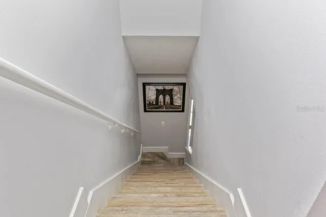 a view of a swimming pool with sitting area