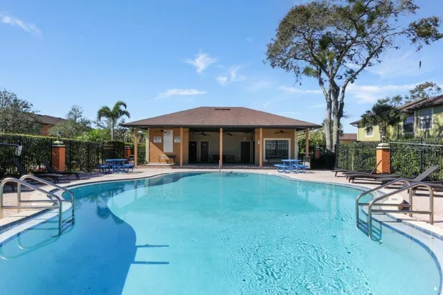 a view of a swimming pool with a yard