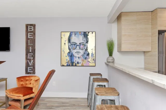 a view of a livingroom with furniture and a flat screen tv