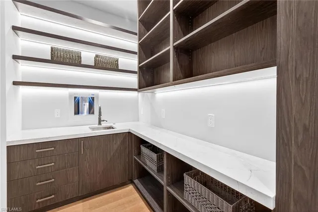 a spacious bedroom with a large bed and a large window