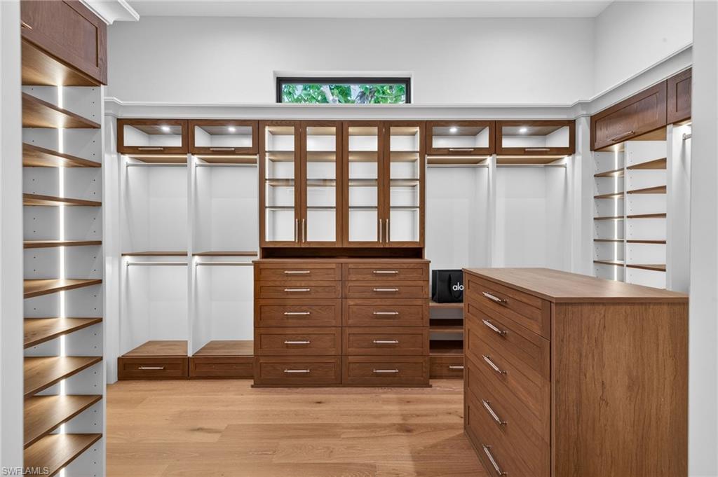 1456 Curlew Avenue Naples, FL 34102 - Photo 22 of 35 a view of walk in closet with empty racks