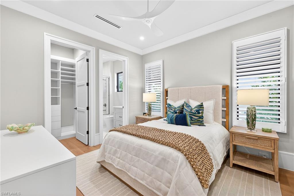 1456 Curlew Avenue Naples, FL 34102 - Photo 28 of 35 a bedroom with a bed and a dresser