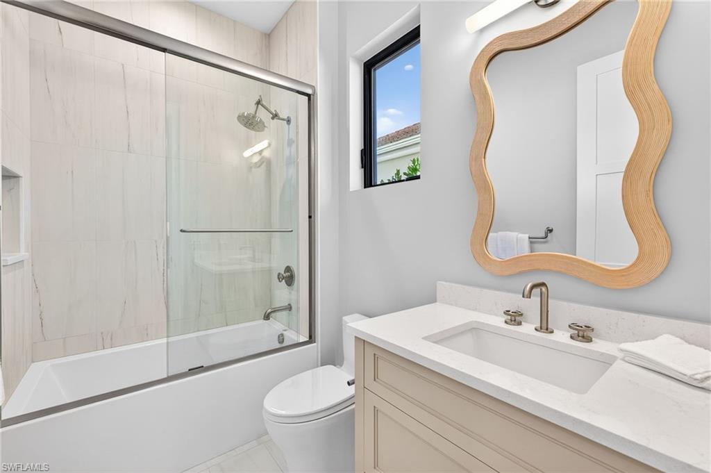 1456 Curlew Avenue Naples, FL 34102 - Photo 29 of 35 a bathroom with a sink toilet and shower