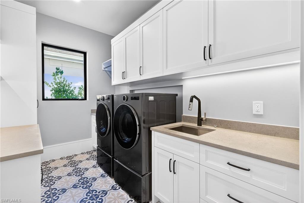 1456 Curlew Avenue Naples, FL 34102 - Photo 33 of 35 a utility room with sink dryer and washer