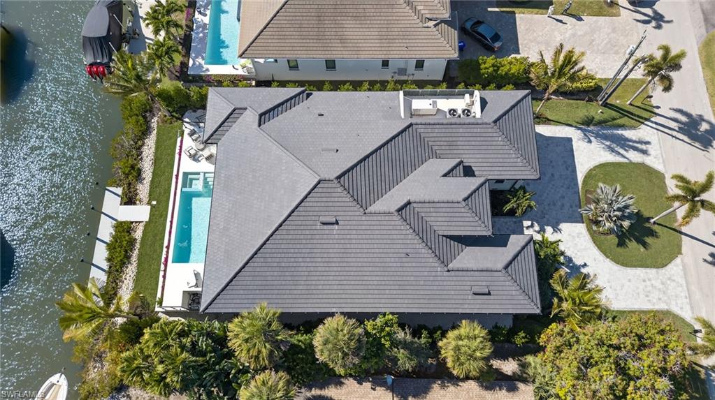 1456 Curlew Avenue Naples, FL 34102 - Photo 35 of 35 a view of a backyard with potted plants