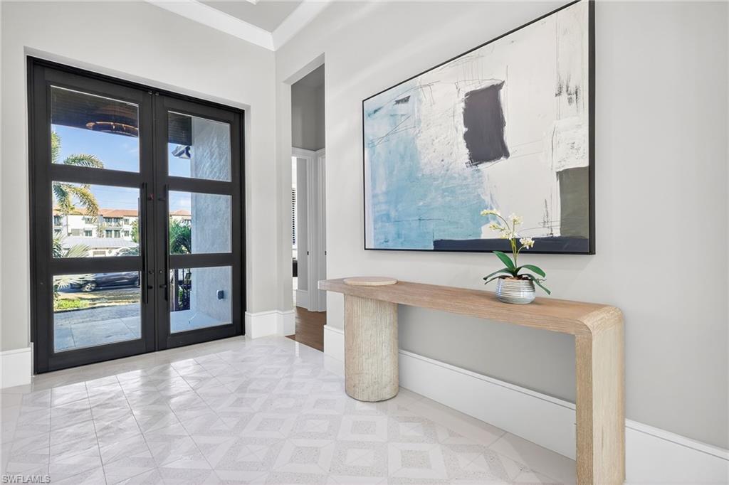 1456 Curlew Avenue Naples, FL 34102 - Photo 6 of 35 a bathroom with a tub sink and mirror