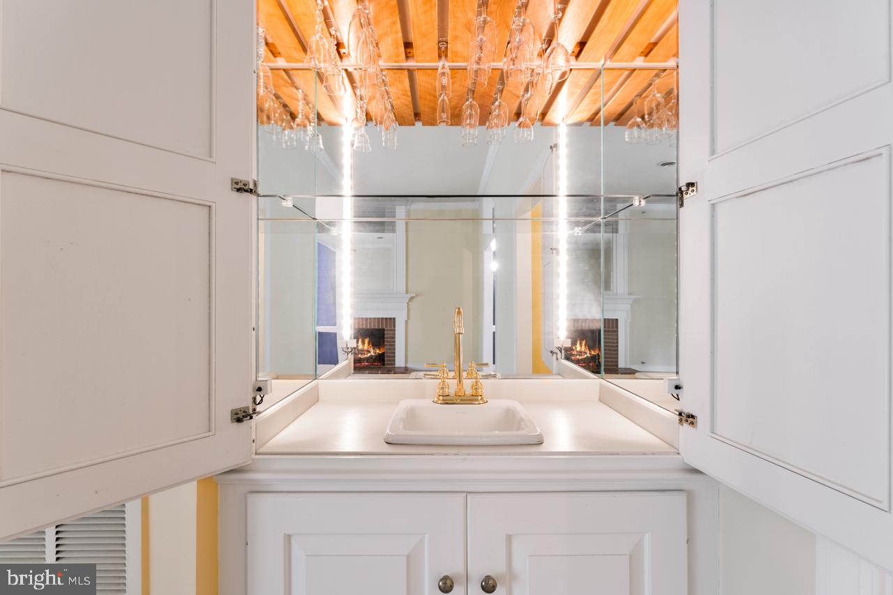 820 Sunken Road, Unit 9 Fredericksburg, VA 22401 - Photo 19 of 41 West bar in living room with doors and lighting