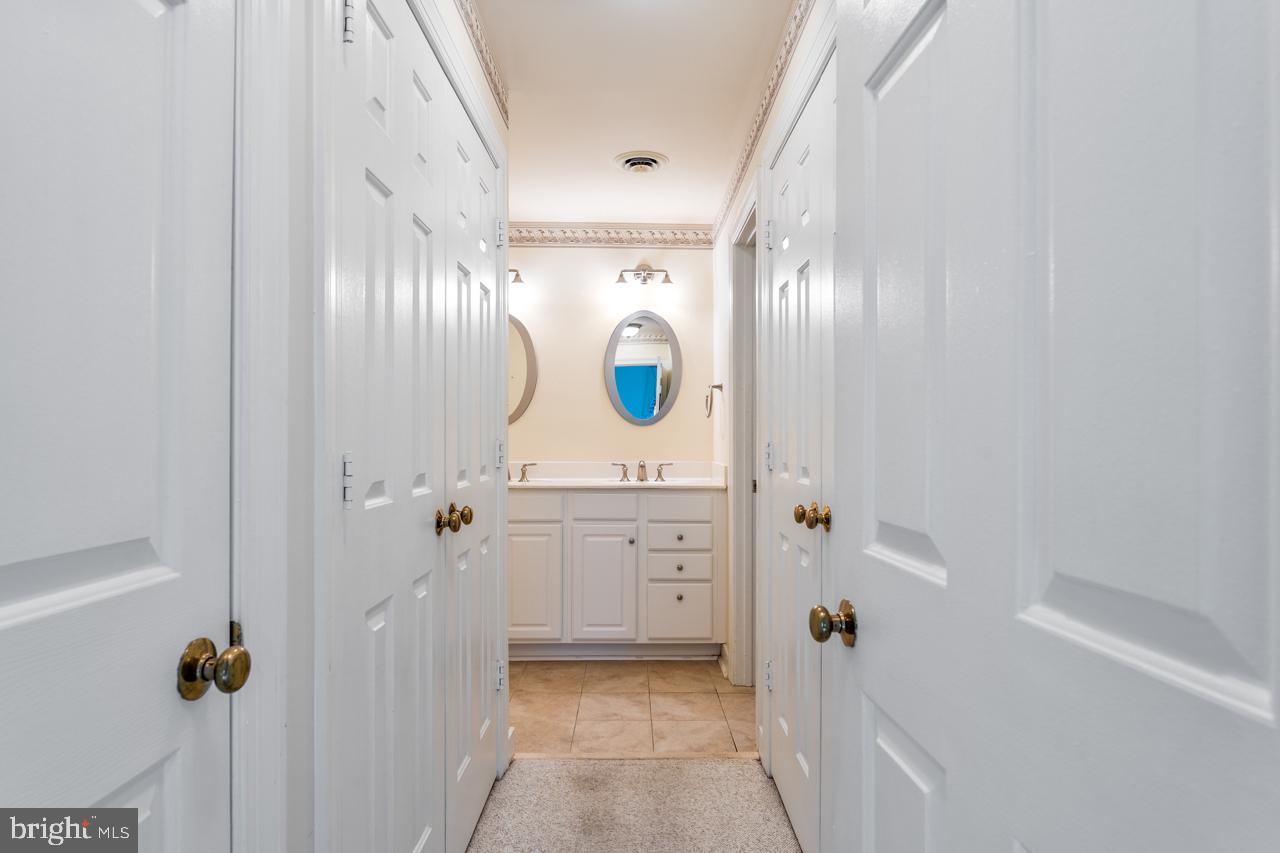 820 Sunken Road, Unit 9 Fredericksburg, VA 22401 - Photo 31 of 41 View into master bath & closets along the way