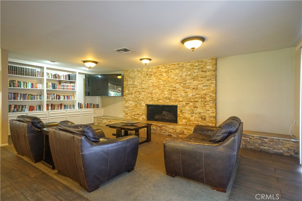 1919 West Coronet Avenue, Unit 190 Anaheim, CA 92801 - Photo 25 of 31 a living room with furniture and a fireplace