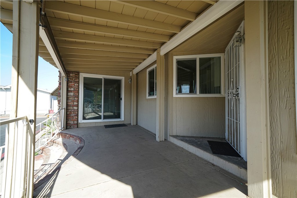 1919 West Coronet Avenue, Unit 190 Anaheim, CA 92801 - Photo 4 of 31 a view of a porch of the house