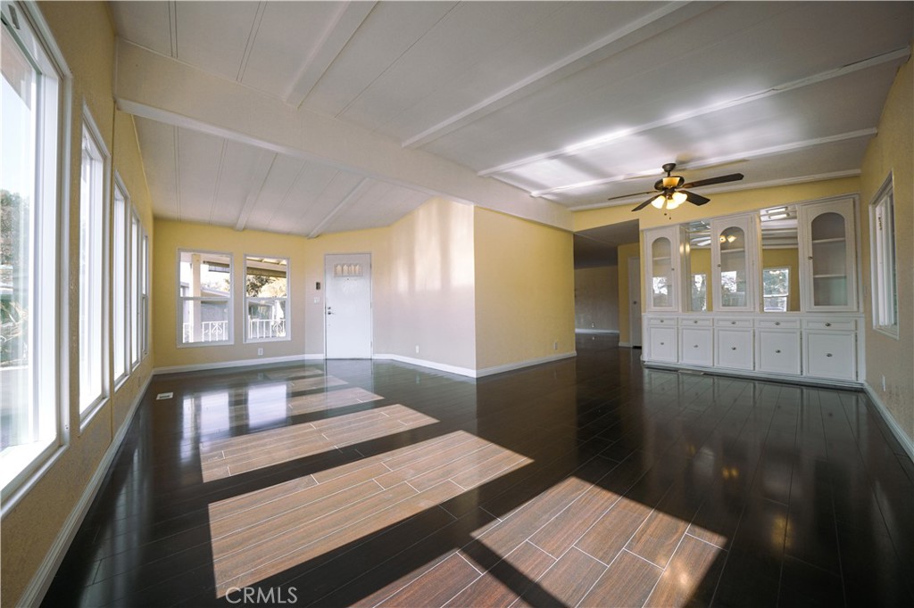 1919 West Coronet Avenue, Unit 190 Anaheim, CA 92801 - Photo 5 of 31 a view of a hallway to a livingroom with furniture
