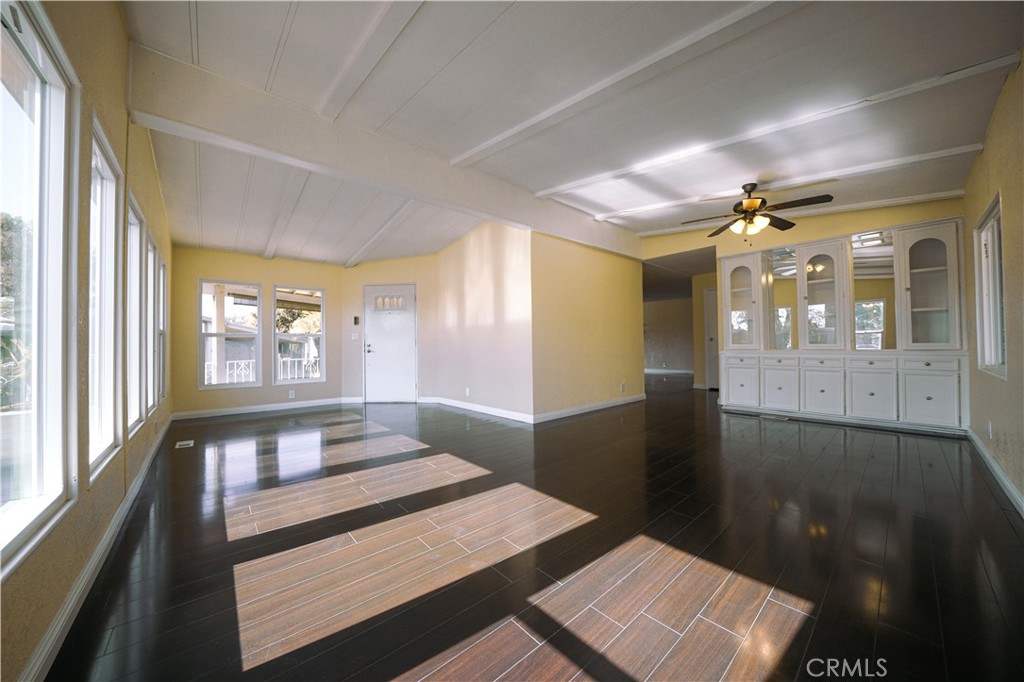 1919 West Coronet Avenue, Unit 190 Anaheim, CA 92801 - Photo 7 of 31 a view of a hallway and a livingroom with furniture