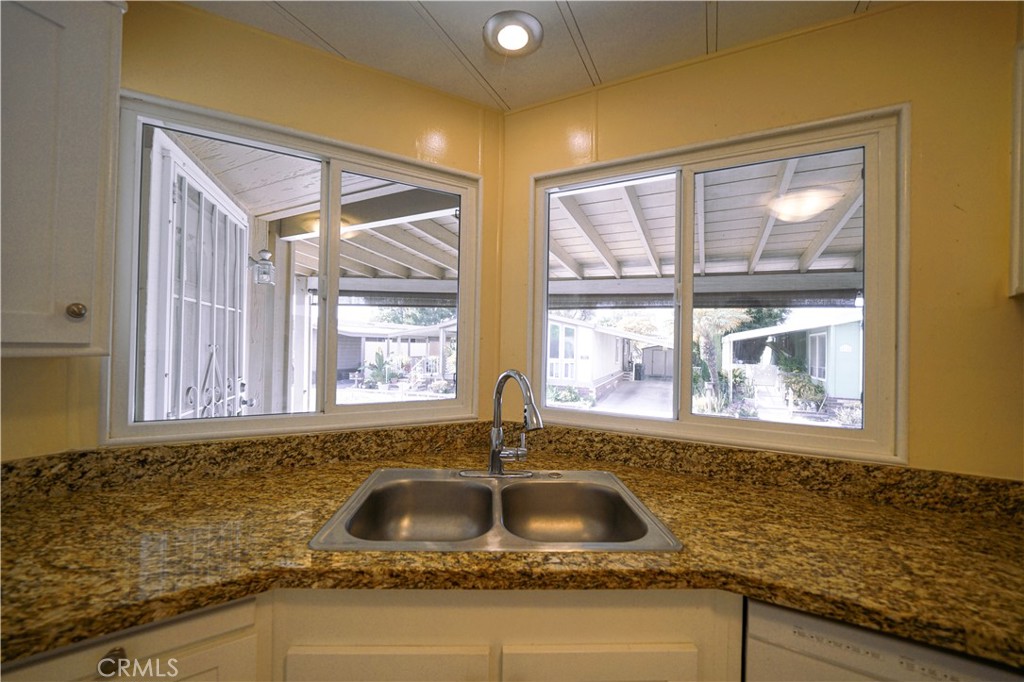 1919 West Coronet Avenue, Unit 190 Anaheim, CA 92801 - Photo 10 of 31 a kitchen with sink and window