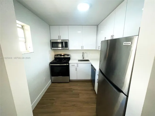 a view of swimming pool with wooden fence