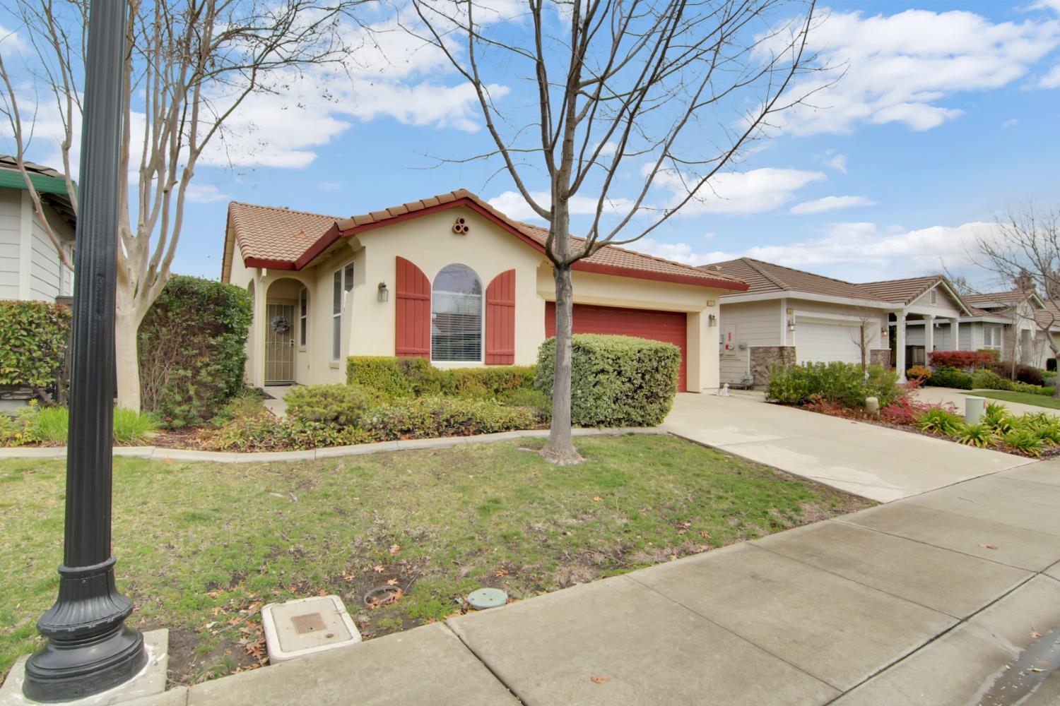 351 Pelican Bay Circle Sacramento, CA 95835 - Photo 1 of 30 a front view of a house with garden