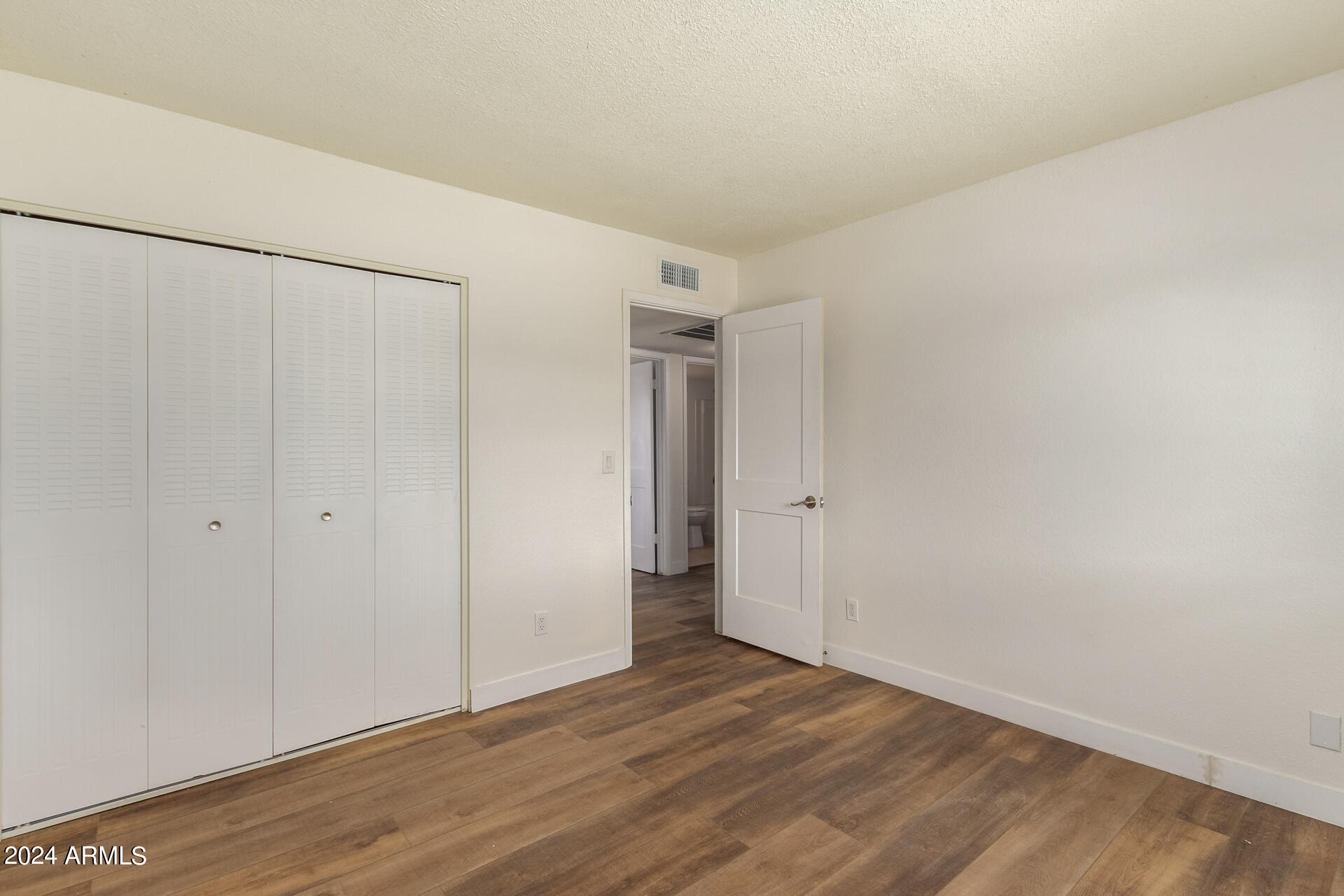1528 West Maldonado Road Phoenix, AZ 85041 - Photo 12 of 19 a view of an empty room