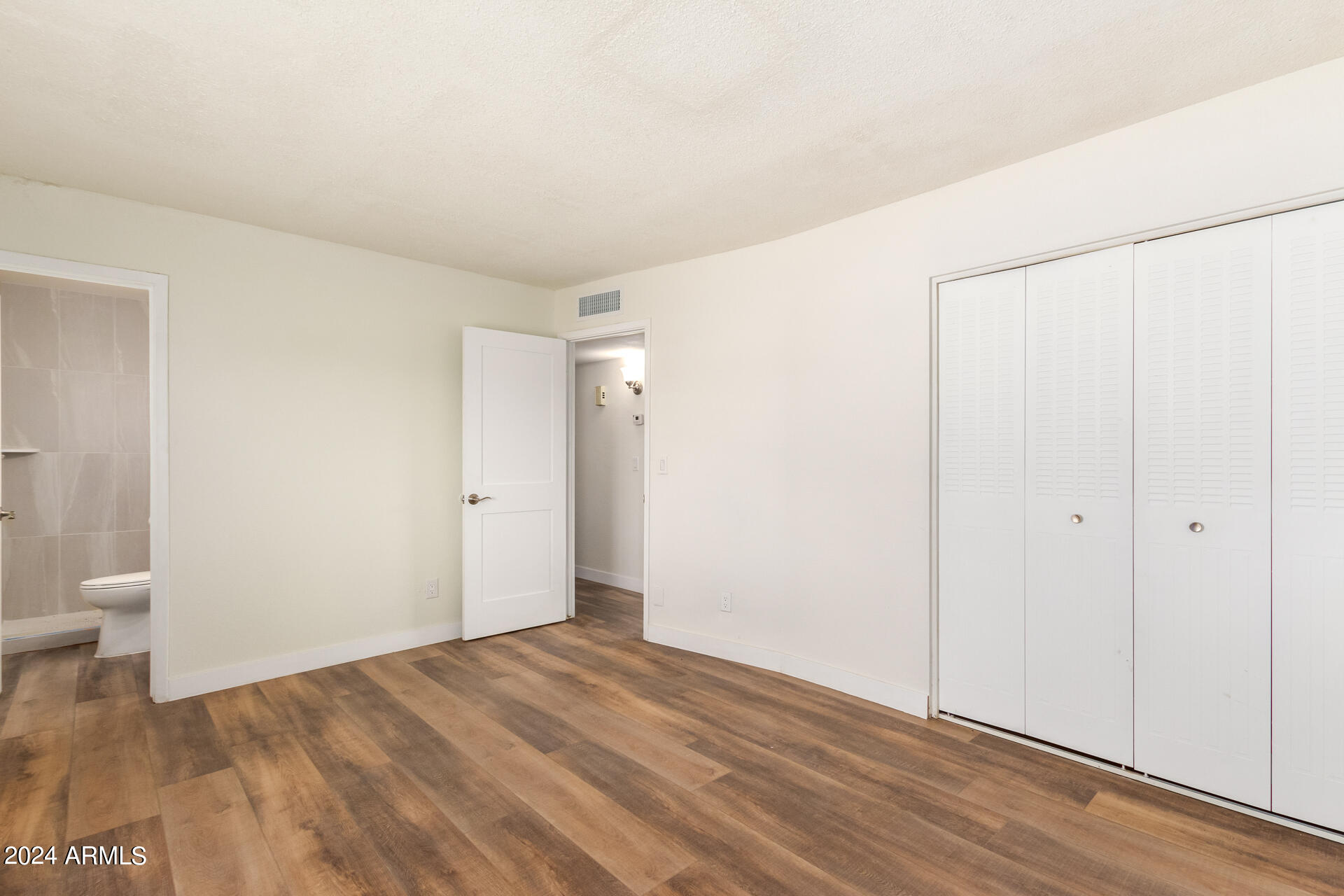 1528 West Maldonado Road Phoenix, AZ 85041 - Photo 15 of 19 a view of an empty room