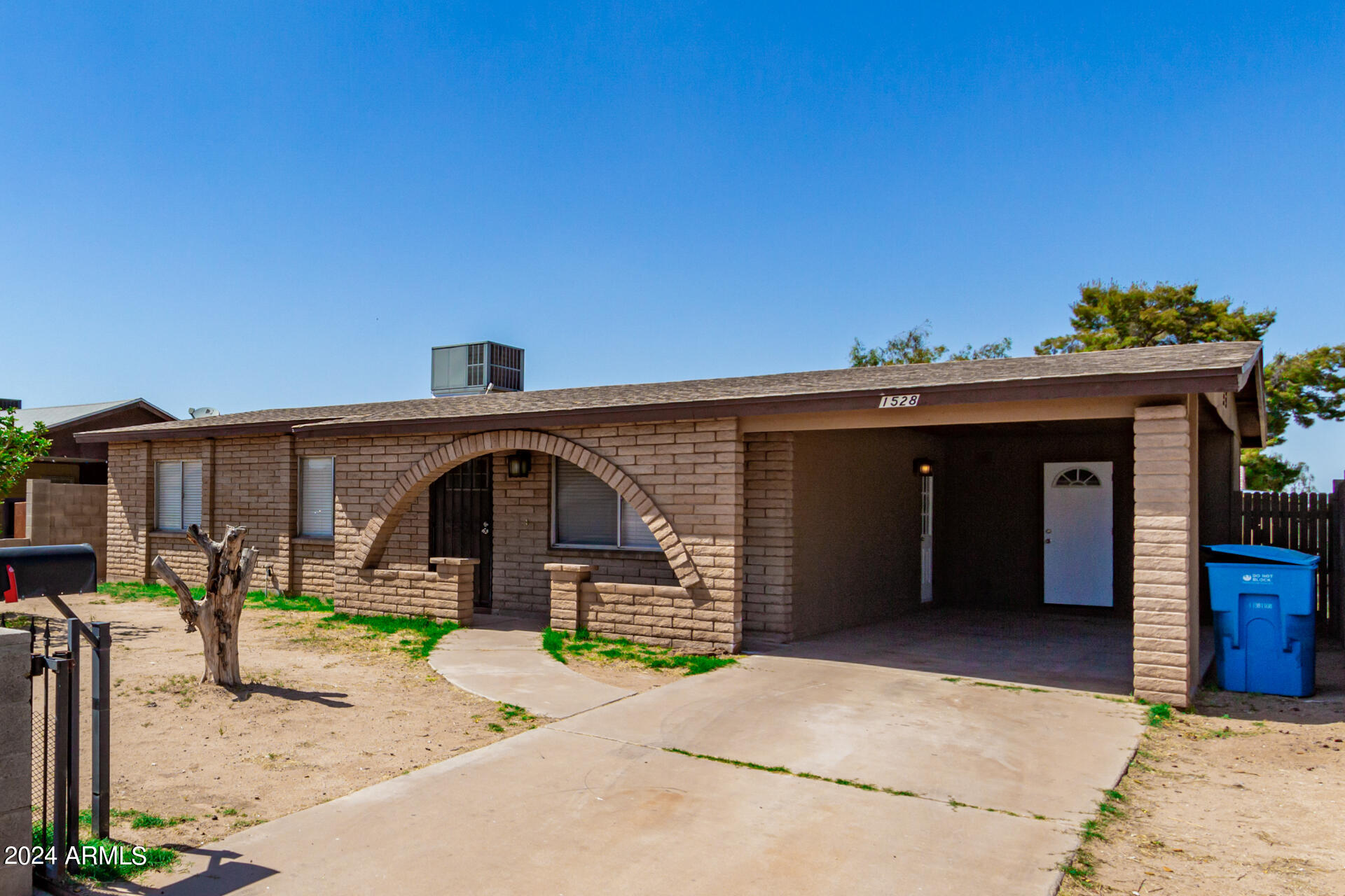 1528 West Maldonado Road Phoenix, AZ 85041 - Photo 3 of 19 a front view of a house with garden