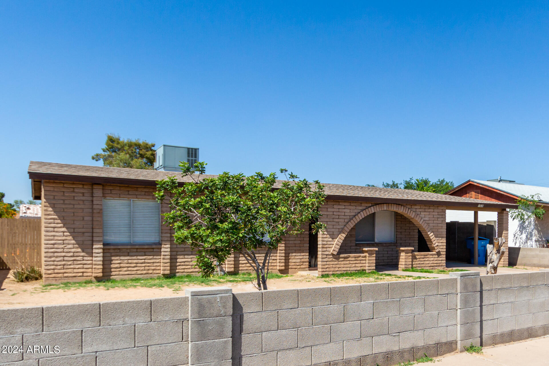 1528 West Maldonado Road Phoenix, AZ 85041 - Photo 4 of 19 a front view of a house with a yard