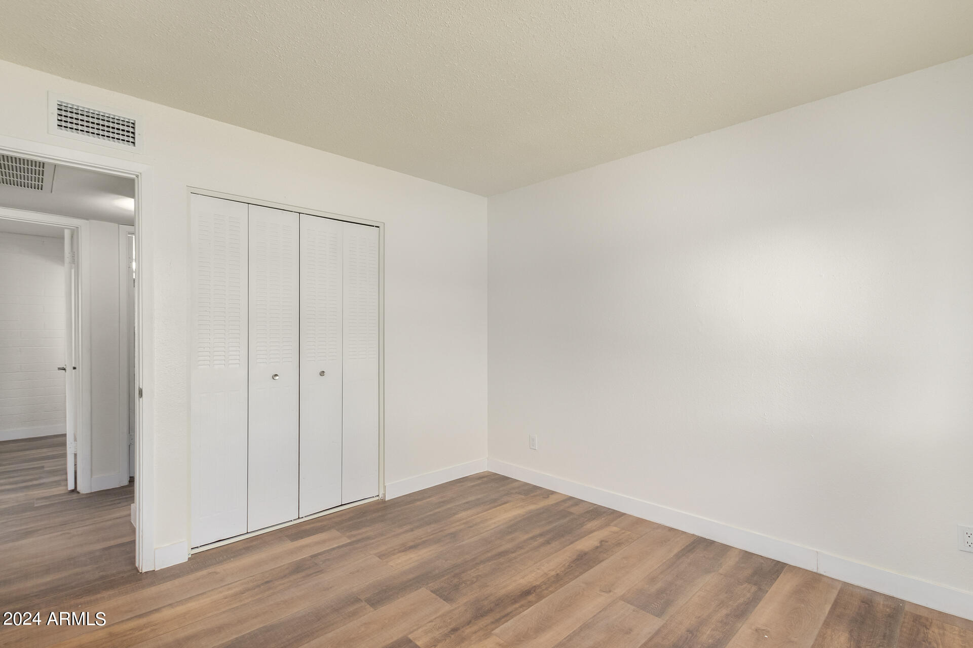 1528 West Maldonado Road Phoenix, AZ 85041 - Photo 10 of 19 a view of an empty room